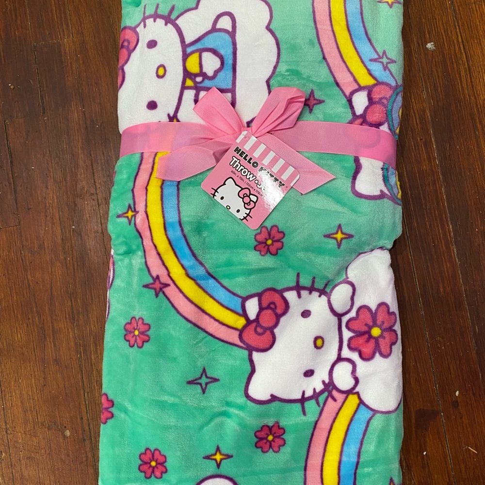 Hello kitty throw rainbow green background